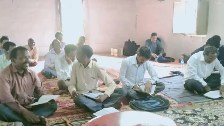 men's Bible study group sitting on the floor