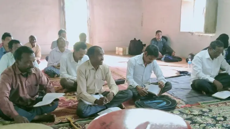 men's Bible study group sitting on the floor